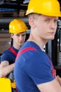 Workers next to forklift Royalty Free Stock Photo