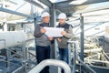workers next to tanks in oil blending factory Royalty Free Stock Photo