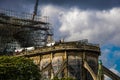 Workers at the north gable of Notre Dame de Paris reinforced by wooden structures after fire that started in the attic