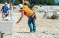 Workers operating in contruction building site Royalty Free Stock Photo