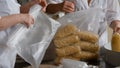 Workers packaging raw macaroni from the production line in a pasta manufactury Royalty Free Stock Photo