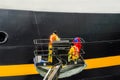 Workers Painting the Starboard of a Cruise Ship