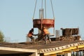 Workers performing pouring concrete work on the reinforced surface Royalty Free Stock Photo