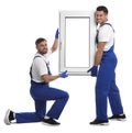 Workers with plastic window on white. Installation service Royalty Free Stock Photo