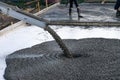 Workers pour the Foundation for the construction of a residential building using mobile concrete mixers. Royalty Free Stock Photo