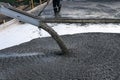 Workers pour the Foundation for the construction of a residential building using mobile concrete mixers. Royalty Free Stock Photo