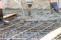 Workers pour the Foundation for the construction of a residential building.