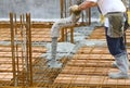 Workers pouring concrete