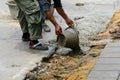 Workers pouring concrete