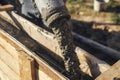 Workers pouring concrete in formwork for foundation. Construction site, process of house building. Builders pouring concrete with Royalty Free Stock Photo