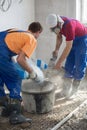 Workers prepare the mixture to fill the Royalty Free Stock Photo