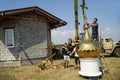 Workers prepare to install a dome on the roof of a small suburban Christian temple using a crane. July 11, 2020, Russia, Royalty Free Stock Photo