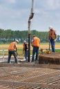 Workers preparing a concrete foundation of a Dutch wind turbine