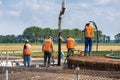 Workers preparing a concrete foundation of a Dutch wind turbine