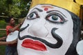 Workers preparing a head of monster size effigy of ten headed demon king Ravan in Bhopal