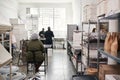 People working in a small artisanal chocolate making factory Royalty Free Stock Photo