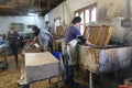 Workers process pulp at a small paper factory