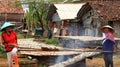 Workers processing fish in the fish drying industry Royalty Free Stock Photo