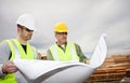 Workers Reading Construction Plans Royalty Free Stock Photo