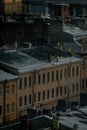 Workers remove snow from roofs