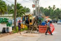 Workers removed a layer of asphalt from the road to lay pipes. Repair construction work on the street of the island in Thailand