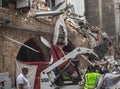 Workers removing rubble from a street