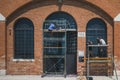 Workers renovating windows of a building at Arsenale in Venice, Italy Royalty Free Stock Photo