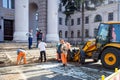 Minsk, Belarus, April 4, 2018: Workers repair the entrance staircase to the building