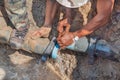 Workers repair leg stomp on Plumbing broken to hole fix water leak at big on the road