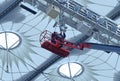 Workers repair sports lighting fixtures of the stadium using boom lift Royalty Free Stock Photo