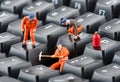 Workers repairing keyboard Royalty Free Stock Photo