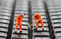 Workers repairing keyboard Royalty Free Stock Photo