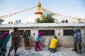 Workers repairing of Stupa Boudhanath, in Kathmandu, Nepal.