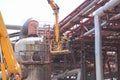 Workers repairmen fitter welders repair pipelines at an oil refining petrochemical chemical industrial plant