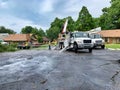 Workers replacing a power pole