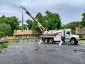 Workers replacing a power pole