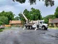 Workers replacing a power pole