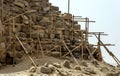 Workers restoring a corner section of the Bent Pyramid at Dahshur in Egypt take a rest break.