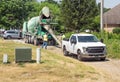 Workers Rinsing Cement Truck Chute During Drought Royalty Free Stock Photo