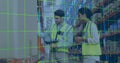 Workers in safety vests verifying stock in warehouse aisle, with barcode scanner, smartphone, boxes Royalty Free Stock Photo