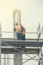 Workers on scaffold platform tied rebar and steel bars 2