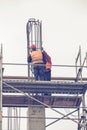 Workers on scaffold platform tied rebar and steel bars 3