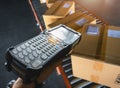 Workers Scanning Bar Code Scanner with Packaging Boxes on Conveyor Belt. Shipping Supplies Warehouse. Computer Mobile Work Tools Royalty Free Stock Photo