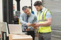 Workers scanning package in warehouse Royalty Free Stock Photo