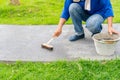 Workers scrub and coating pravement in the garden Royalty Free Stock Photo