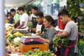 Workers selling vegetables at street market