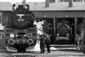 Workers servicing a steam engine locomotive at Wolsztyn Steam Locomotives Depot `Parowozownia Wolsztyn`