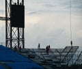 Workers setting up grandstand seating. Royalty Free Stock Photo