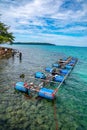 Workers settle and setup the waterworks fountain machine on the surface of the sea