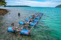 Workers settle and setup the waterworks fountain machine on the surface of the sea